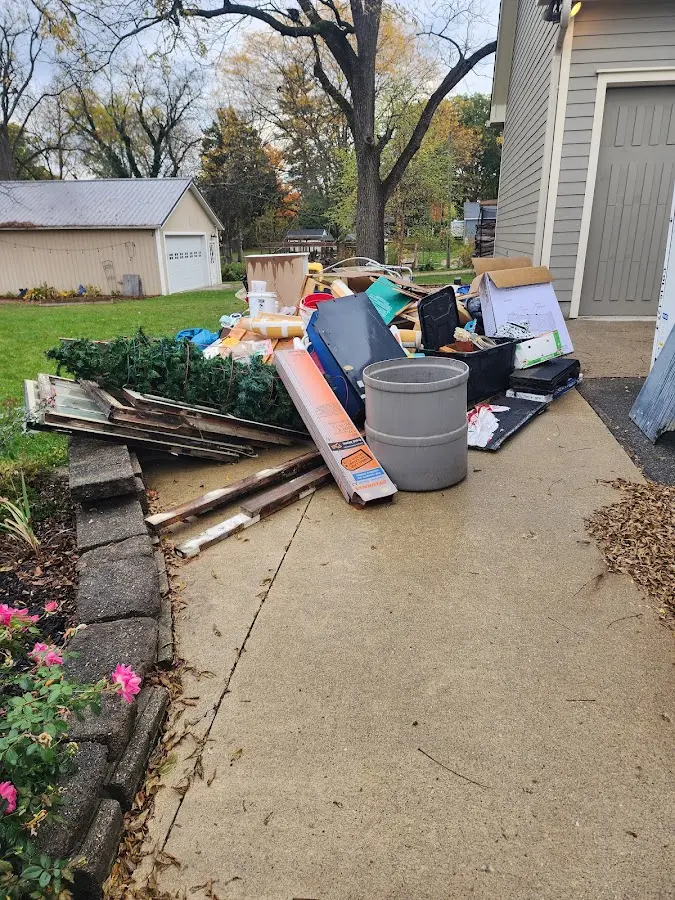 Dumpster being loaded with debris for 3 Yard Dumpster Rental in Clementon